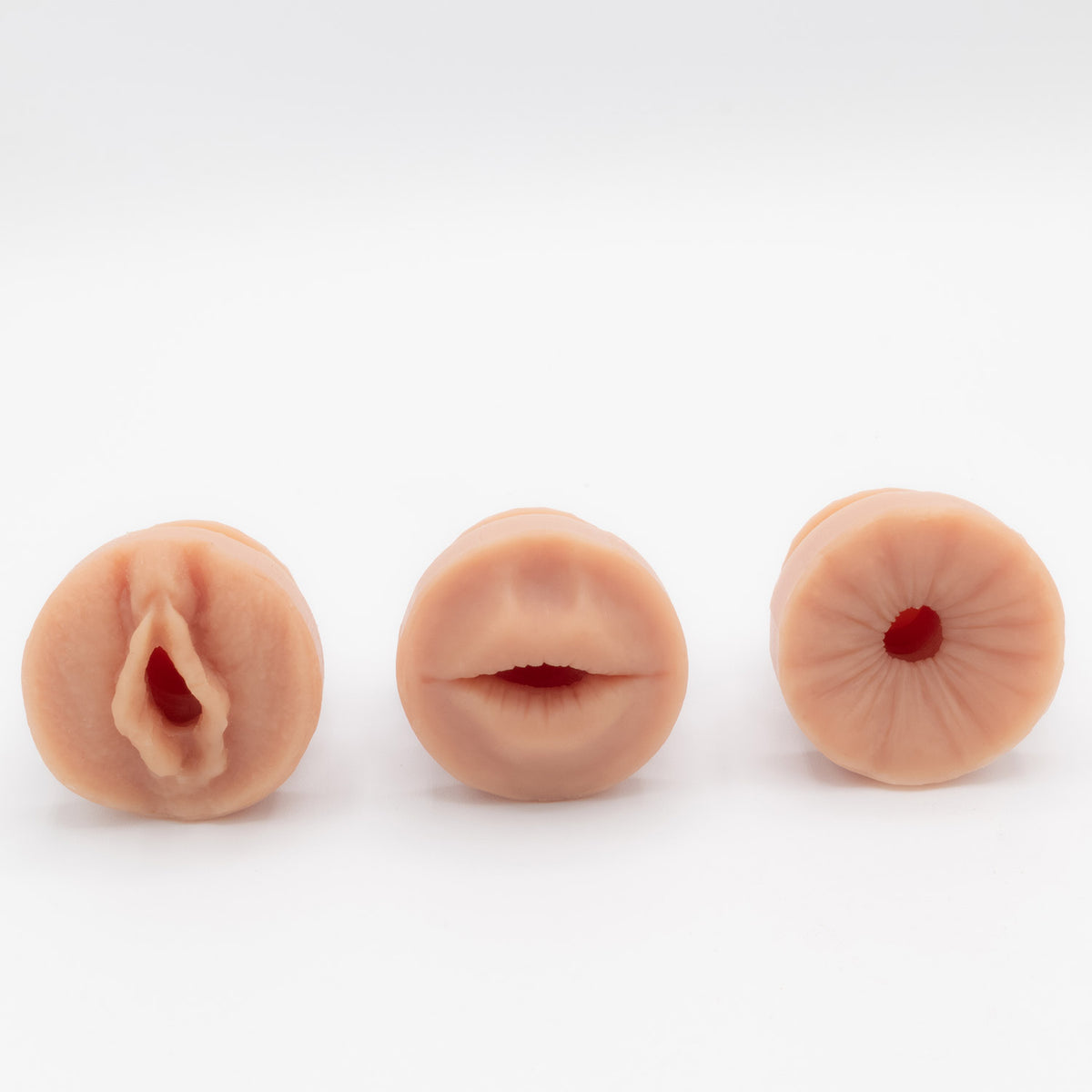 Three silicone realistic sensation plugs for HP1 Banana prosthetics hard penis. Featuring a vulva, a mouth and an anus. 