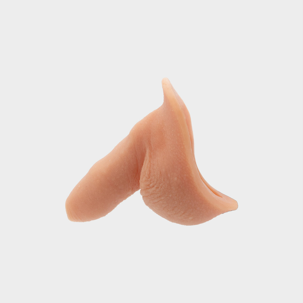 Side view of banana prosthetics realistic Stand-to-pee packer. It features skin-like wrinkles and veins. 