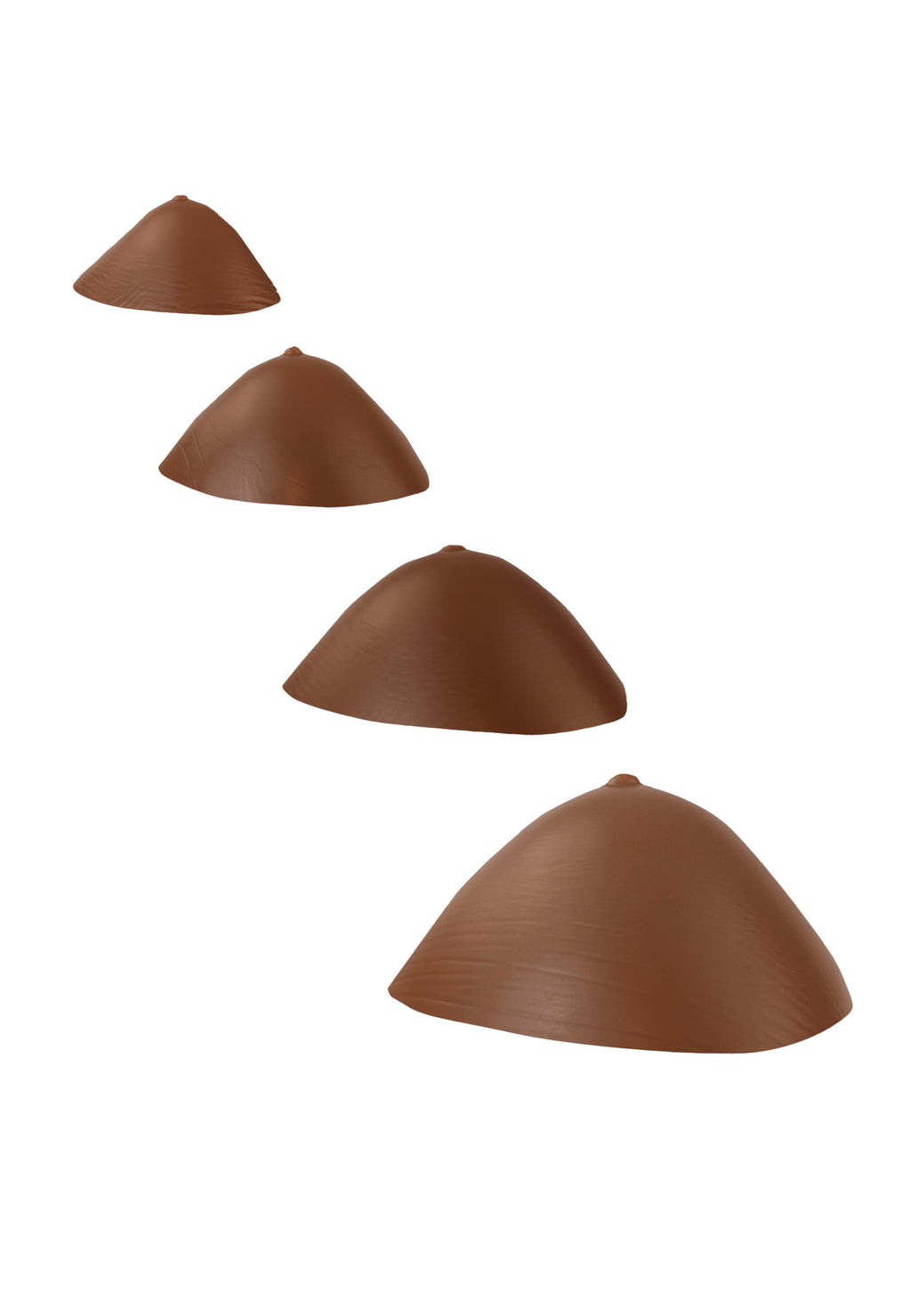Breast forms or silicone realistic breast prostheses for trans women, mtf, drag queens, cosplayers. Caramel skin tone. 4 sizes from A to D cup. 
