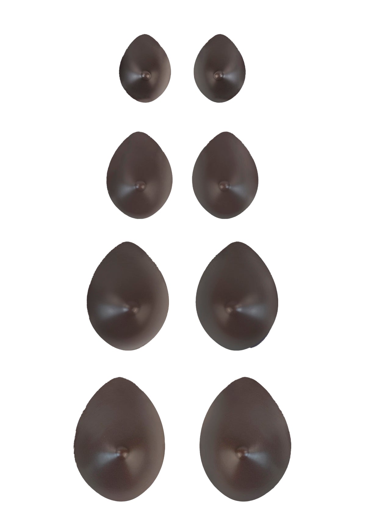 Breast forms or silicone realistic breast prostheses for trans women, mtf, drag queens, cosplayers. Dark chocolate. 4 sizes from A to D cup. Oval shape. Pair view.