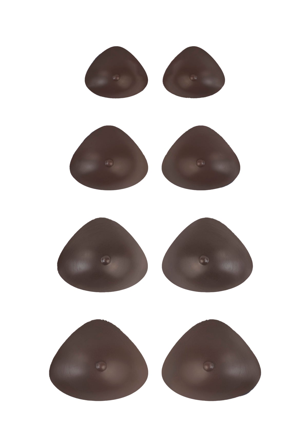 Breast forms or silicone realistic breast prostheses for trans women, mtf, drag queens, cosplayers. Dark chocolate color. 4 sizes from A to D cup. Triangular.