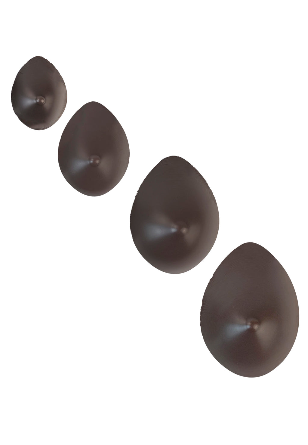 Breast forms or silicone realistic breast prostheses for trans women, mtf, drag queens, cosplayers. Dark chocolate. 4 sizes from A to D cup. Oval shape.