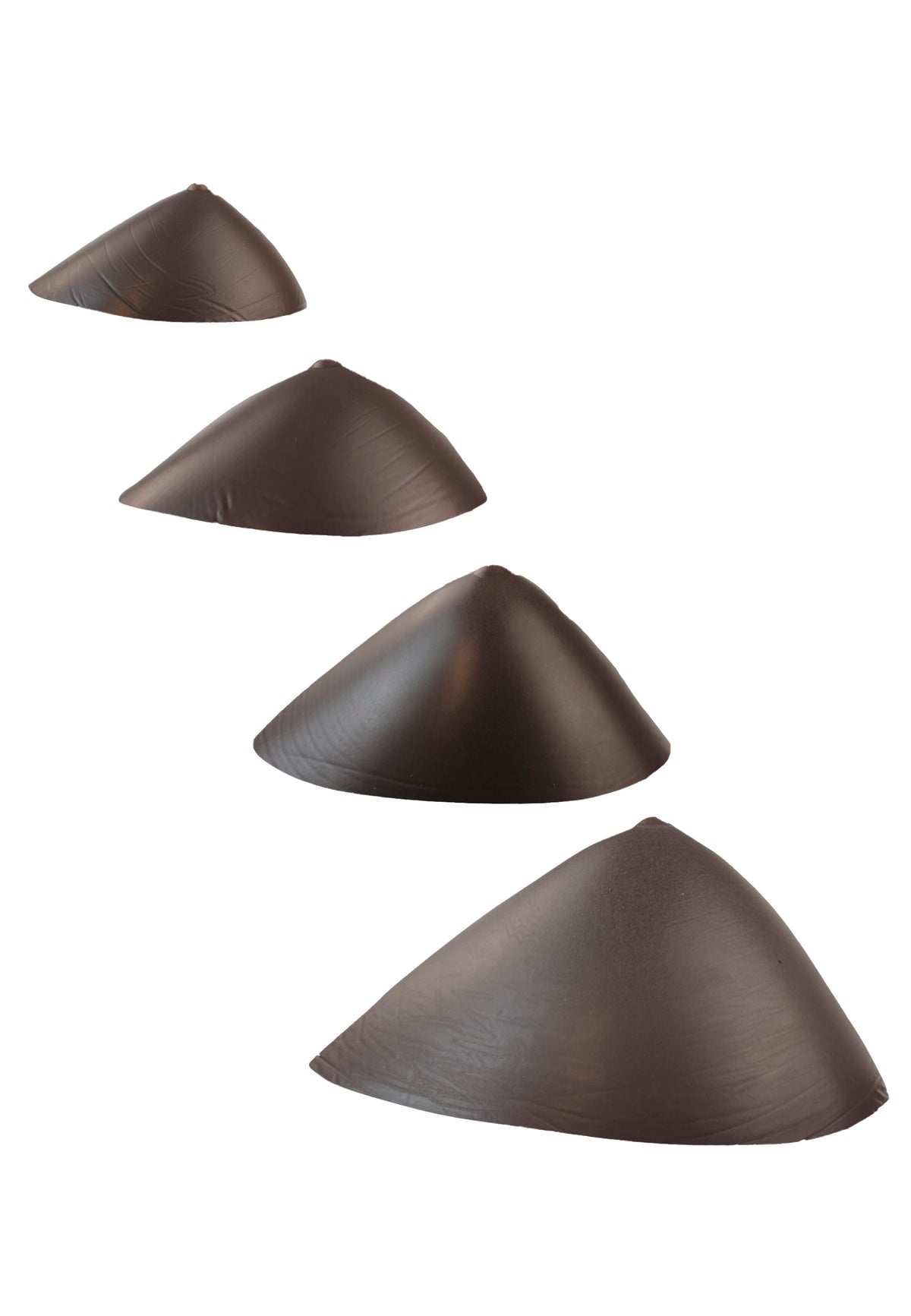 Breast forms or silicone realistic breast prostheses for trans women, mtf, drag queens, cosplayers. Dark chocolate. 4 sizes from A to D cup. Oval shape. Bottom view.