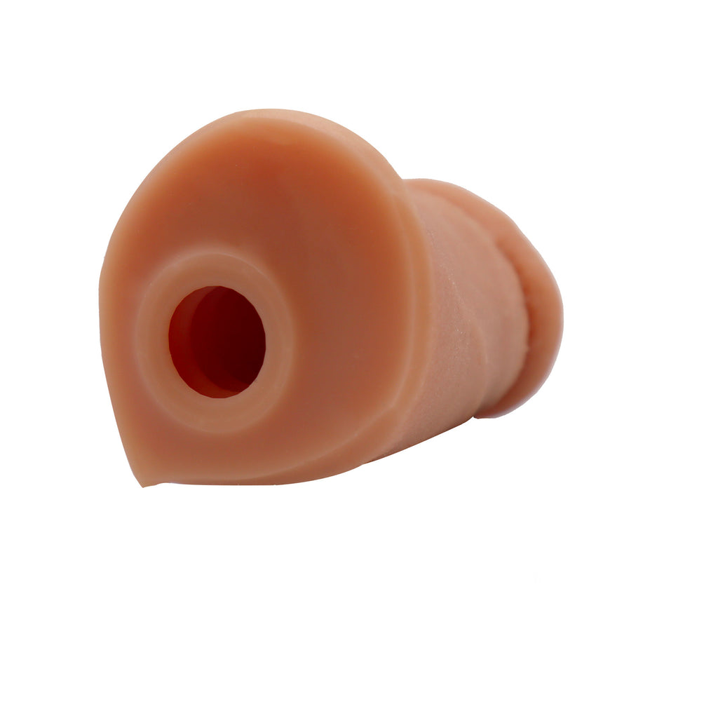The hole of a banana prosthetics stroker where trans people on T can insert the bottom growth for masturbation. 